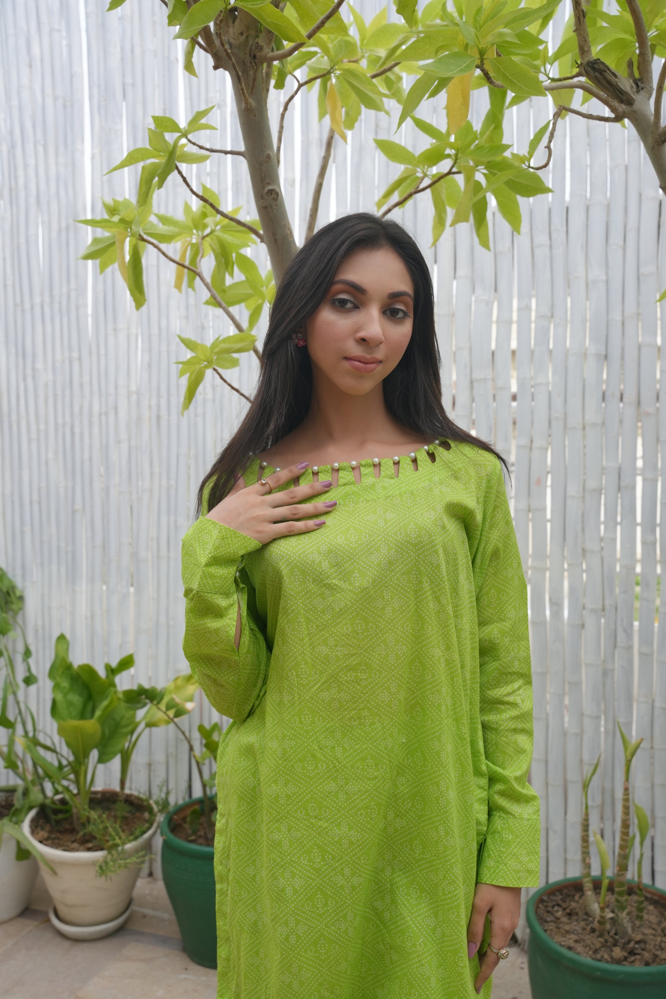 Printed Green Elegance: Kurta & Trouser Set with Unique Neckline pearl Detailing