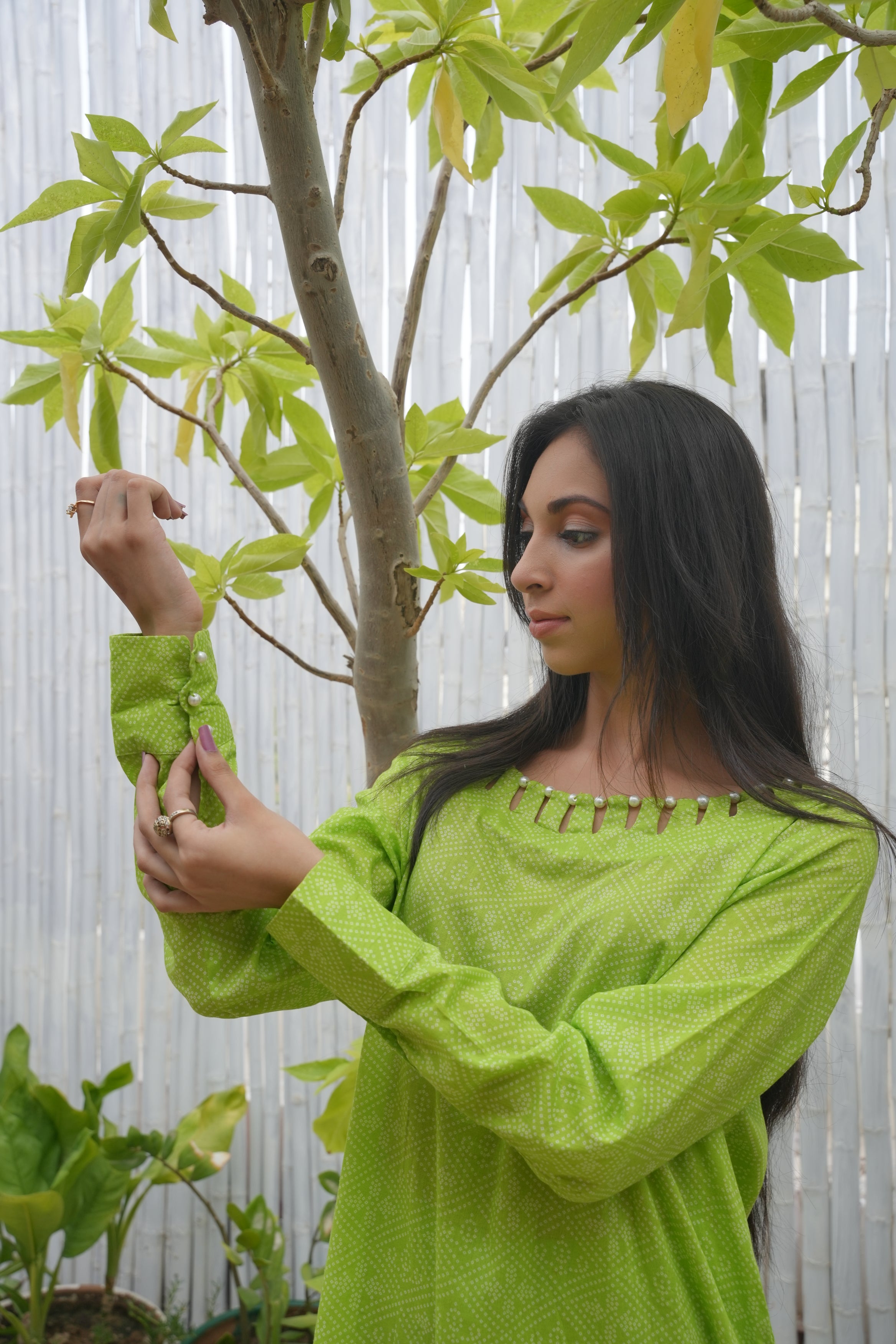 Printed Green Elegance: Kurta & Trouser Set with Unique Neckline pearl Detailing